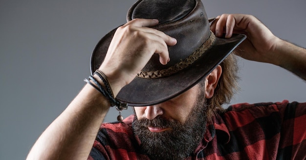 American cowboy Leather Cowboy Hat Portrait of young man wearing cowboy hat Cowboys in hat Handsome bearded macho