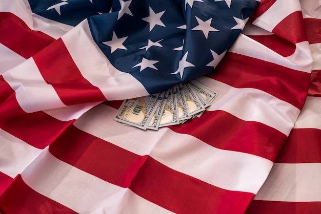 American dollar banknotes on national flag closeup