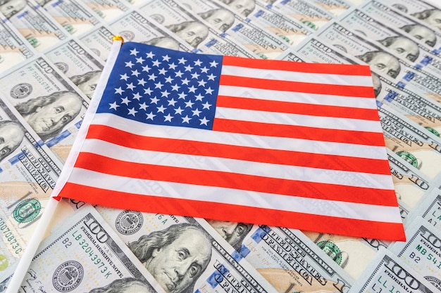 American flag and dollar cash money Dollar banknote and United States flag background Economy of USA