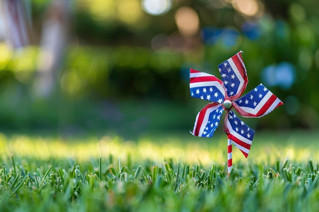 American flag pinwheel in the green lawn and blurred background