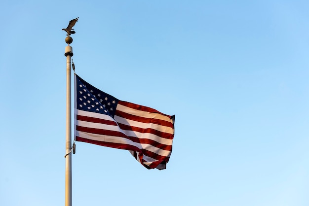 American Flag waving against blue Sky, USA Flag waving 