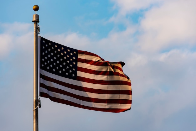 American Flag waving against blue Sky, USA Flag waving 