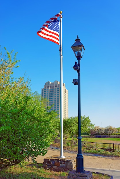 American Flag waving by the wind in parkway of Philadelphia, Pennsylvania, the USA. Modern art