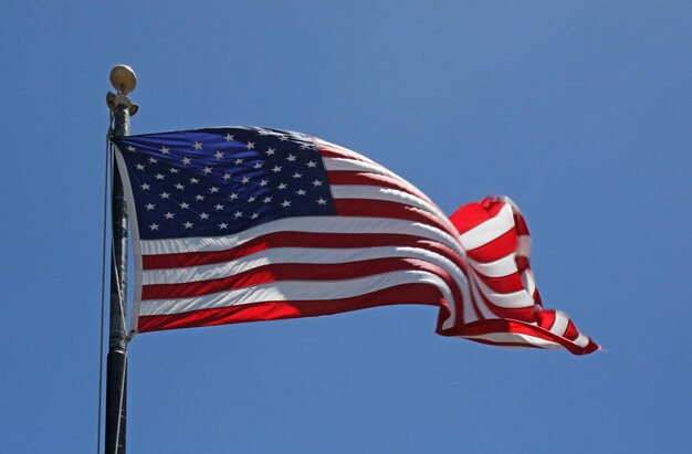 American flag waving on a sunny day