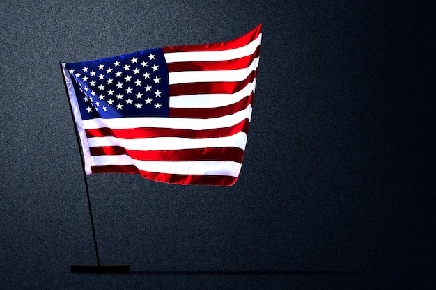 American flag waving with a black background. Fourth of July Concept