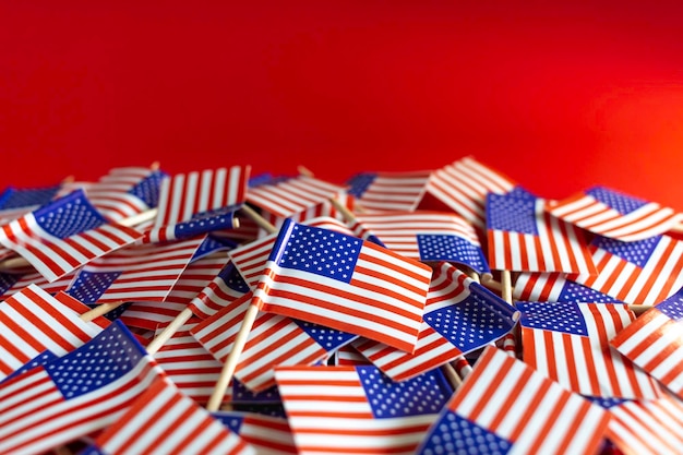 American flags flat lay on the red background with copy space Happy Independence day USA