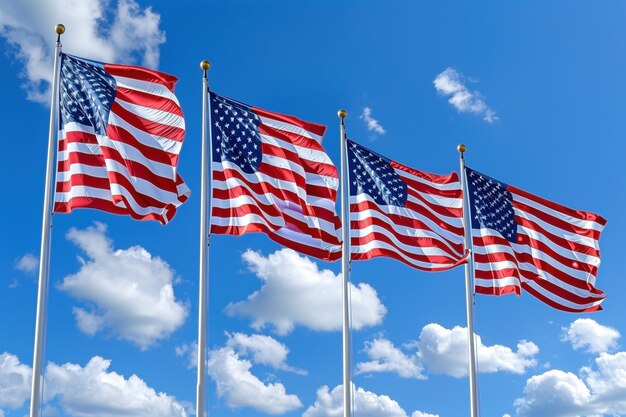 American flags hanging at tall poles in a row over blue sky