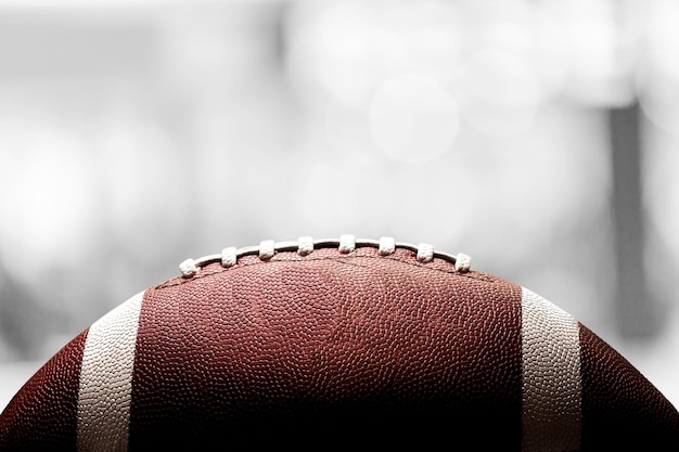 American football ball on blur background