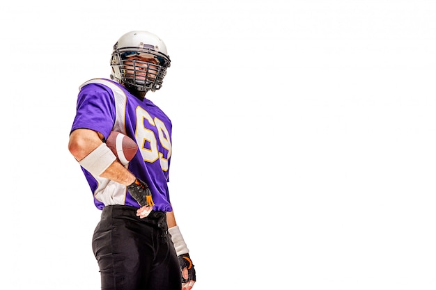 American football player poses in uniform