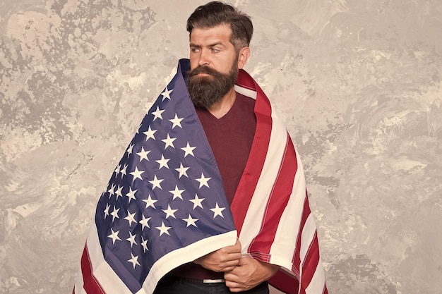 American hipster man celebrate independence day with national flag holidays concept