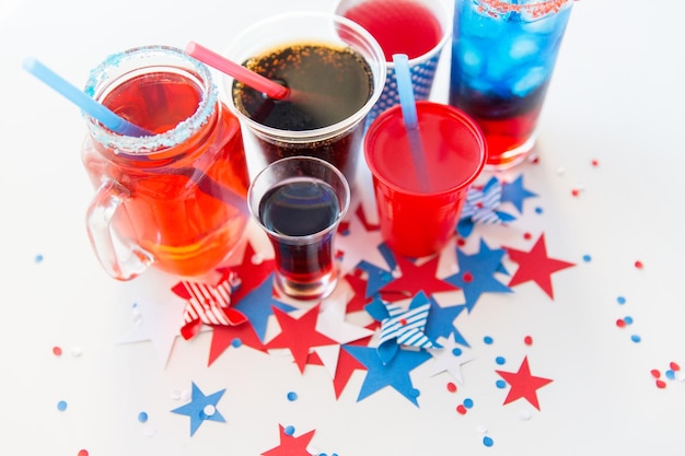 american independence day, celebration, patriotism and holidays concept - close up of cups and glasses with drinks on american independence day party from top