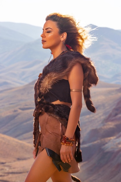 American Indian girl in native costume headdress made of feathers of birds