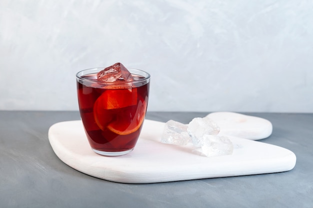 Americano Alcohol cocktail with red vermouth bitter soda water orange zest and ice