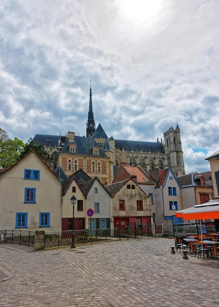 Amiens Cathedral of Notre Dame and traditional houses on Rue de Don Street at the embankment of Somme canal, Picardy, France