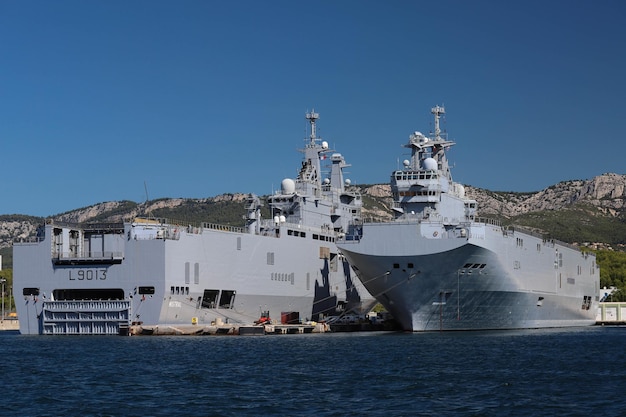 The amphibious assault ships Le Mistral and Le Tonnerre docked in the France Navy base at the harbor of Toulon France