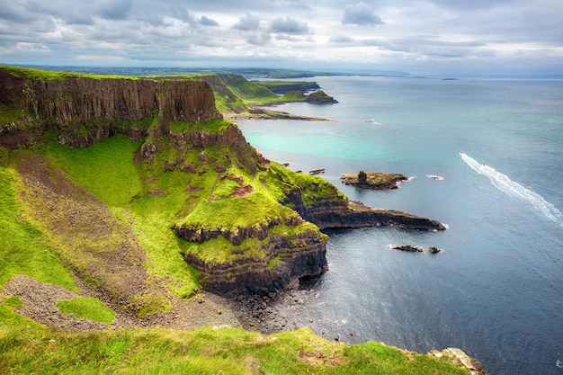 The Amphitheatre Port Reostan Bay and Giant's Causeway on background County Antrim Northern Ireland UK