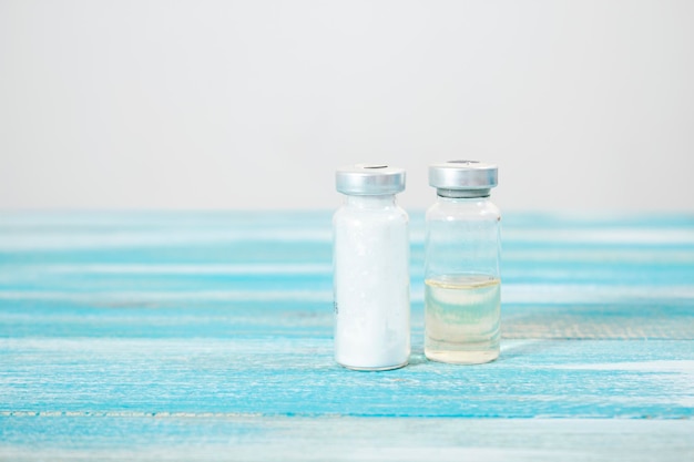 Ampoules on a blue wooden table