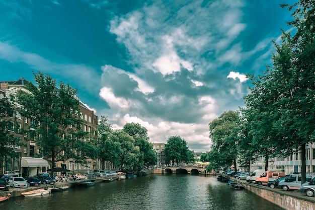 Amsterdam canal bridge and boats Holland