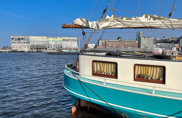 Amsterdam canals houseboat at central station betherlands in spring