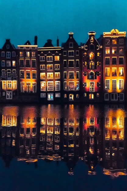 Amsterdam, Netherlands, Europe Traditional old narrow houses and canals in Amsterdam, the capital of the Netherlands in autumn night. High quality photo