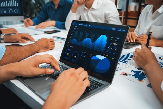 Analyst team uses BI Fintech display laptop to analyze financial data Business people analyze BI software technology dashboard power for insights power into business marketing planning Prudent