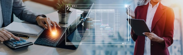 Analyst working with computer in Business Analytics and Data Management System to make report with KPI and metrics connected to database Corporate strategy for finance operations sales marketing