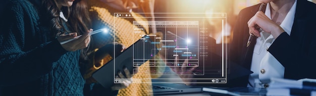 Analyst working with computer in Business Analytics and Data Management System to make report with KPI and metrics connected to database Corporate strategy for finance operations sales marketing