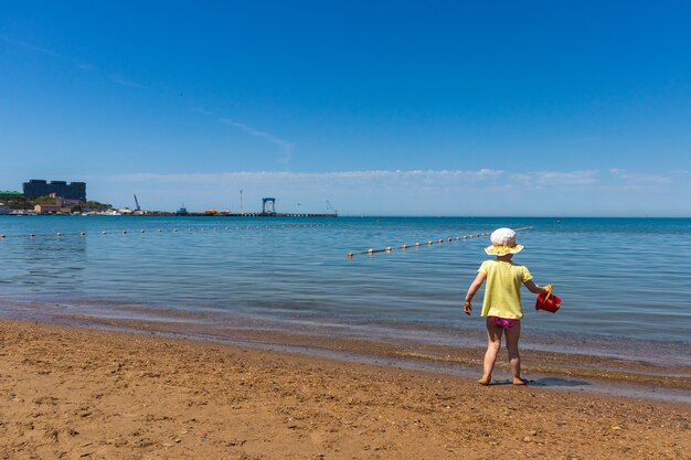 Anapa. Krasnodar Region - May 14, 2021: a child plays on the Black Sea coast