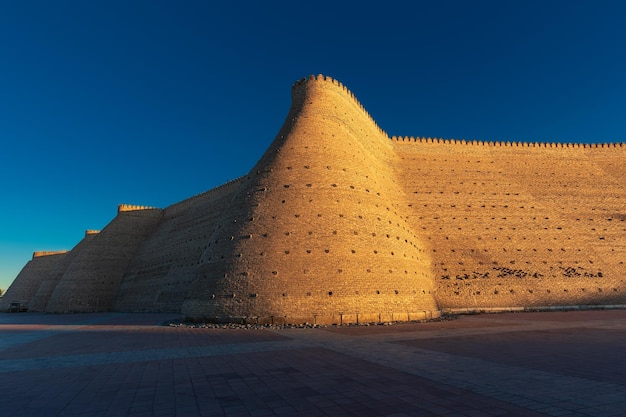 Ancient archaeological heritage Ark citadel with brick walls and towers Bukhara Uzbekistan