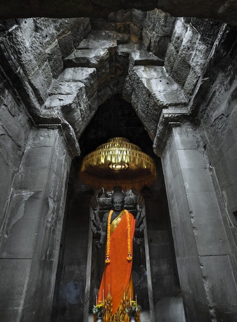 Ancient buddhist altar angkor wat complex largest religious monument in the world cambodia statue of