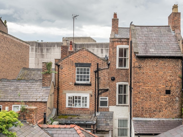 Ancient buildings and amphitheater in Chester city England under cloudy sky