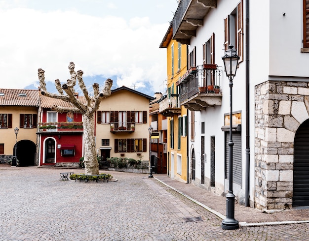 Ancient buildings in the cobbled square of varenna lake como italy