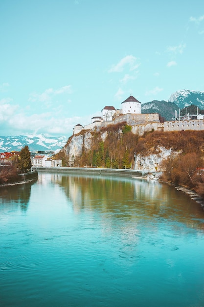 Ancient castle fortress in the Austrian Alps mountains Kufstein reflection of small city in water