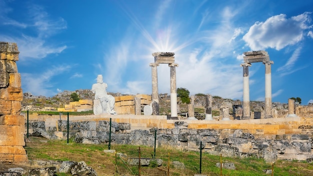 Ancient city of Hierapolis with a statue of Pluto and columns in Pamukkale UNESCO cultural heritage Denizli Turkey