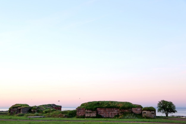 Ancient fortification by the sea on the sunrise