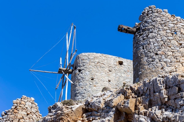 Ancient historic famous dilapidated stone windmills on a sunny day Lassithi area island Crete Greece