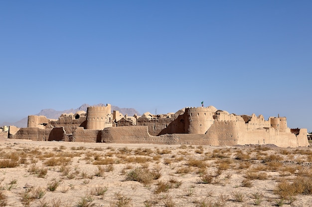 Ancient historical monument and tourist attraction of Iran, ruins of Saryazd clay castle in desert.