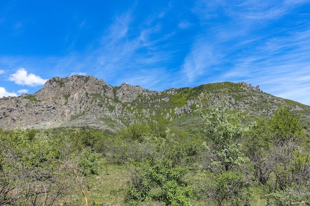 Ancient limestone high mountains in the air haze The Valley of Ghosts Demerji May 2021 Crimea Russia