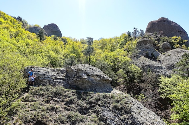 Ancient limestone high mountains of rounded shape in the air haze The Valley of Ghosts Demerji Crimea