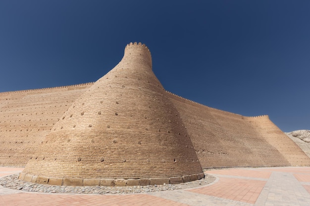 Ancient monumental archaeology heritage Ark citadel with brick walls and towers Bukhara Uzbekistan