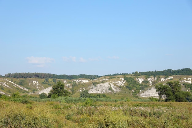 Ancient multimillion chalk mountains on the steppe surface of earth