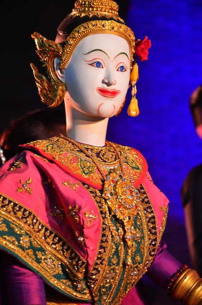 Ancient puppets toy or antique marionette thai style for playing acting on stage show thai people and foreign travelers travel visit festival event fair in night time at Sam Yan in Bangkok Thailand