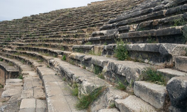 Ancient Roman amphitheater made of stone under the open sky in Pamukkale in Turkey