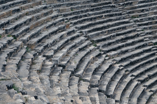 Ancient Roman amphitheater made of stone under the open sky in Pamukkale in Turkey