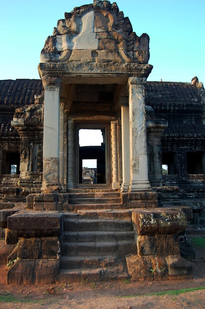 Ancient ruins antique building castle Khmer Empire of Angkor Wat for cambodian people and foreign travelers travel visit respect praying in largest religious temple city complex in Siem Reap Cambodia