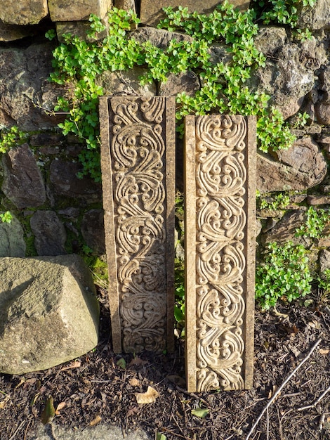 Ancient slabs from the temple Restoration work Part of an ancient masonry Remains of history