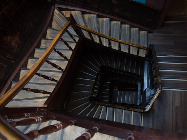 Ancient staircase of a multi-storey building. Directly above.