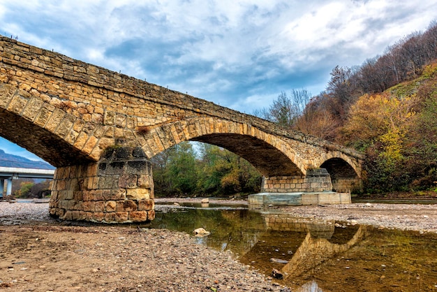 Ancient stone bridge over the Dakh River