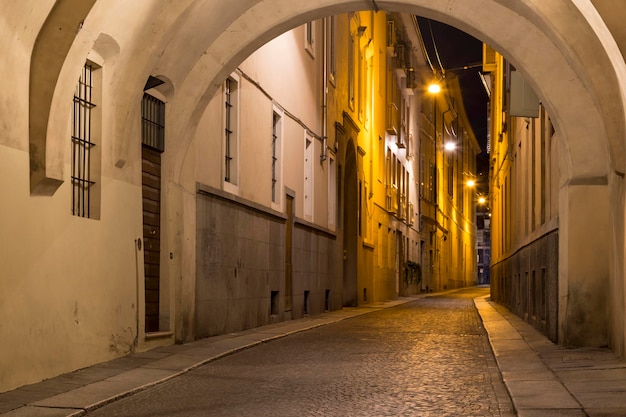 Ancient street Borgo Longhi lit by streetlights at night city Parma EmiliaRomagna province Italy Europe Famous place of tourist destination City of creative gastronomy under the auspices of UNESCO