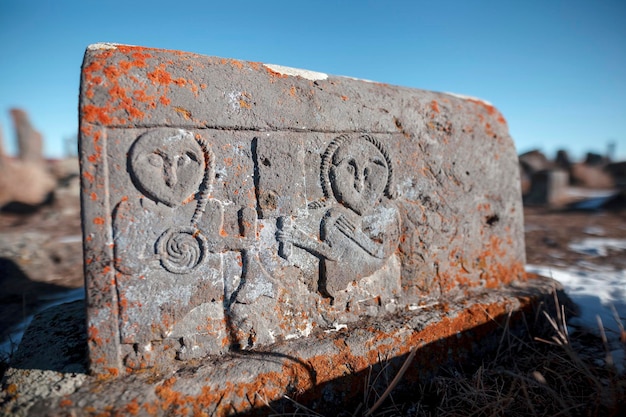 Ancient tombstones called Khachkars on cemetery of Noratus near the Lake Sevan in Armenia Caucasus